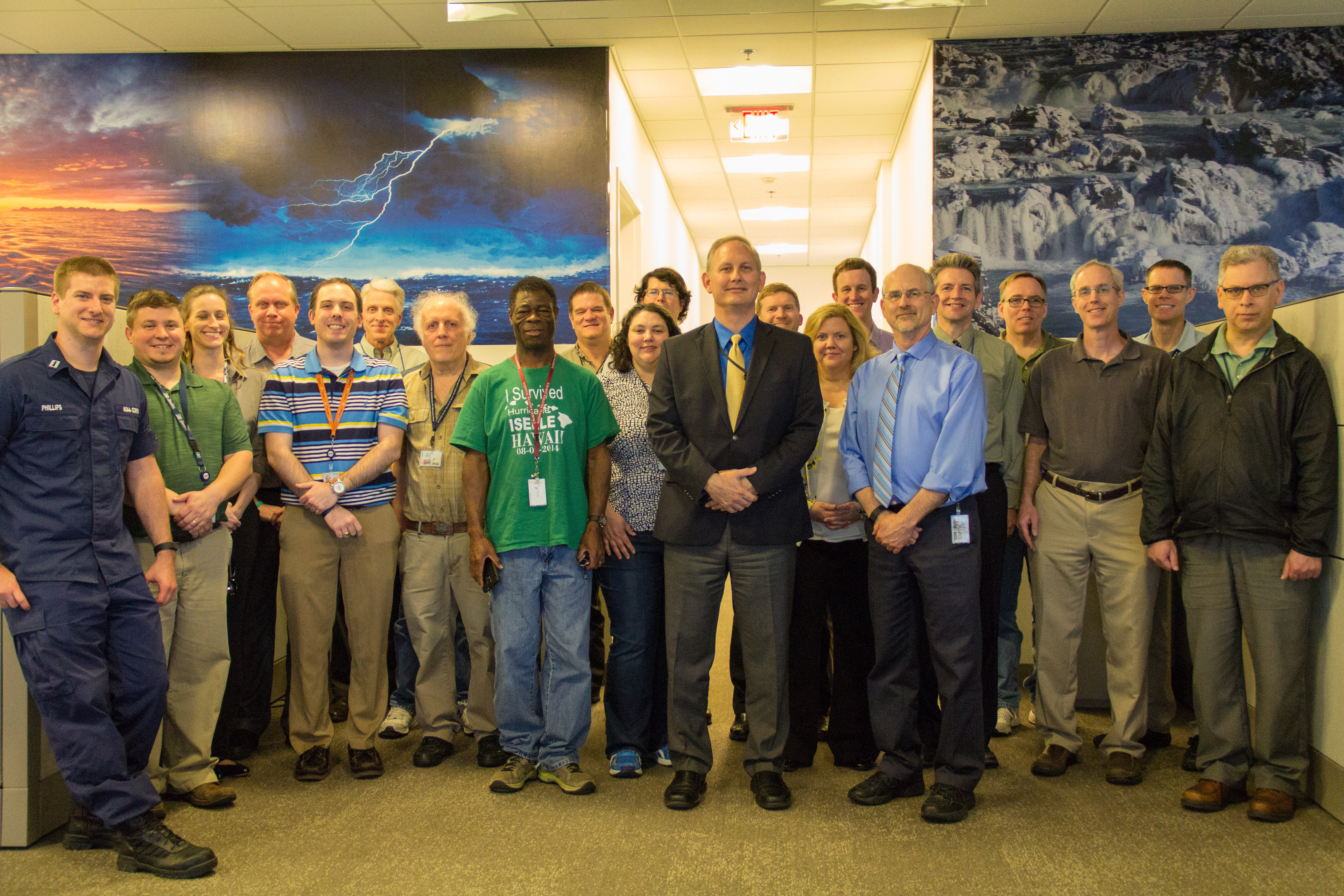 Group photo of Ocean Prediction Center staff memebers on May 25, 2016 in the operational forecast area at the Ocean Prediction Center